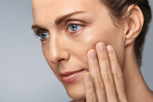 Woman after blepharoplasty surgery with Jonathan Dunne